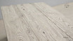 Close-up of the wood grain at the table’s corner, showcasing natural beauty.