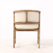 Rear profile of the Thomas and Hurley Windsor Dining Chair with vertical hardwood timber detailing and neutral textured upholstery, emphasising premium construction and timeless furniture styling