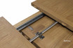A detailed close up of the Sandringham Double Extension Dining Table photographed mid-extension revealing the functionality and workmanship of the durable extension mechanism.