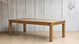 Angled view focusing on the detail and design of the table's solid oak leg