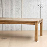 Close-up of one of the table’s solid oak corner legs, showcasing strength and design