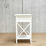 Side view of the bedside table, emphasizing its linear profile and cross-beam leg detailing