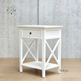 Full-length side view of the bedside table, capturing its elegant height and proportions.