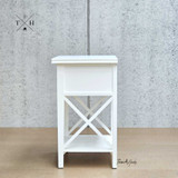 Side view of the bedside table, emphasizing its linear profile and cross-beam leg detailing.