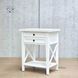 Angled view focusing on the bedside table's crisp white satin finish