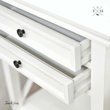 Image of the bedside table with the drawers open, showcasing the ample storage space.