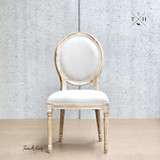 Full frontal view of the Eliza Upholstered Dining  Chair, highlighting its round/balloon back and elegant French-style design