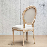 Profile back view emphasizing the distinctive balloon back design, quintessential to the chair’s French styling.