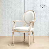 Diagonal angle capturing the unique balloon back design, a key feature of this French-style chair.