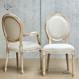 Angled perspective of the Eliza Upholstered Dining Chair and Carver Chair, displaying its proportion and harmony in design.