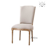 Angled view of the chair, highlighting the blending of traditional and modern elements in its design.