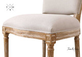 Zoomed-in view of the seat cushion, showcasing the comfort and durability of the linen upholstery.