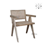 Angle view showcasing the chair’s overall design, including the elegant frame and textural rattan back