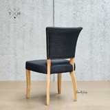 Rear view of the Macallan Dining Chair, illustrating the intricate detailing and tapered legs