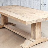 An image capturing the natural wood patterns and grain of the Charlested Oak Dining Table, showcasing its organic beauty