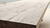 The Charlested Oak Dining Table in a soft shadow, creating a sense of depth and texture in the oak