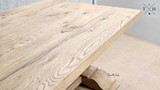 A detailed view of the Charlested Oak Dining Table's surface texture, emphasizing the quality of the finish