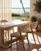 Close up angled view of the Charlested Oak Dining Table in a contemporary seaside home