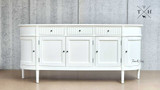 Frontal perspective of the Louis Buffet focusing on the symmetrical arrangement of its grooved drawers, paired with the sleek, modern handles.