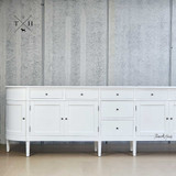 Close Up frontal perspective of the Louis Curved 300cm Buffet focusing on the symmetrical arrangement of its grooved drawers, paired with the sleek, modern handles.