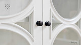 Detailed shot of the arch designs on the doors, reflecting the Neoclassical influence.
