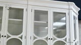 Detailed shot of the carved accents on the cabinet doors, adding a touch of sophistication.