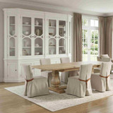 Providing elegant storage for Hamptons inspired, traditional, or modern living or dining spaces, the Stonefield Double Display Cabinet Wall Unit with Angled Sides by Thomas and Hurley is shown here with the Sandringham Double Extension Dining Table and Carlyle Chairs.