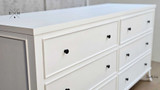 Close-up of the top drawer knob detailing the elegant hardware.
