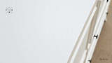Close-up of the Piastri 6 Drawer chest finish showcasing the white paint stroke patina.