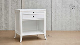 Side view of Piastri Bedside Table highlighting the classic design and hand-carved molding.