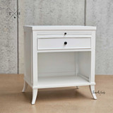 Angled view of Piastri 1 Drawer Bedside showcasing the spacious drawer, open shelf and an elegant silhouette.