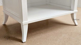 Close-up of the bedside table’s legs, featuring unique design for a timeless look.