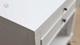 Close-up of the bedside table's surface, highlighting the paint stroke finish and quality craftsmanship