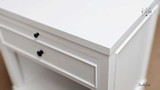 Close-up of the Piastri 1 Drawer table white paint stroke finish