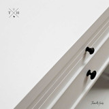 Close-up of the bedside table's surface, highlighting the finish and quality craftsmanship