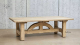 Angled perspective of the Trailbridge Canyon Coffee Table displaying the intricate details of the arch design beneath the tabletop.