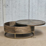 Detailed view of the coffee table's rotating top in mid-rotation, showcasing functionality.