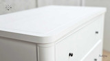 Close-up of the top drawer knob detailing the elegant hardware.