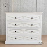 Front view of the Fremont 4 Drawer Chest showcasing its elegant white finish.