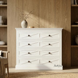 Close Front Styled view of the Fremont 4 Drawer Chest in white in a modern home