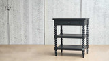 Angled view of the Montclair Bedside Table displaying the single drawer and two lower shelves.