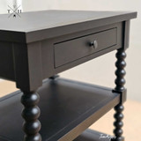 Close up view of the Montclair Side Table showcasing its unique spindle leg features