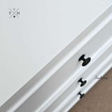 Close-up of the bedside table's surface, highlighting the paint stroke finish and quality craftsmanship