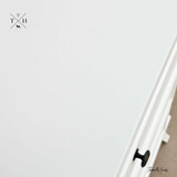 Close-up of the bedside table surface showcasing the classic and elegant design.
