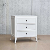 Angled view of Piastri Nightstand showcasing the three spacious drawers and elegant silhouette.