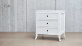 Side view of Piastri Bedside Table highlighting the classic design and hand-carved molding.