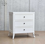Angled view of Piastri 3 Drawer Bedside showcasing the three spacious drawers and an elegant silhouette.