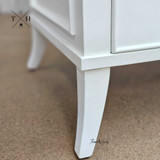 Close-up of the bedside table’s legs, featuring unique design for a timeless look.
