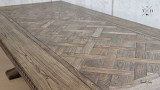 Top-down perspective of the Bedford Oak Dining Table, highlighting its silhouette and parquetry detailing