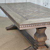 Close-up view of the table’s pedestal base, highlighting its unique and sturdy design